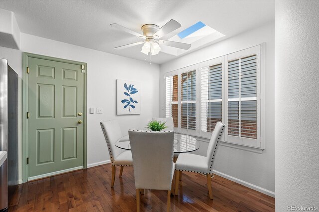 9491 Southern Hills Cir, Lone Tree, CO 80124 - dining space featuring wood-type flooring, ceiling fan, and a skylight