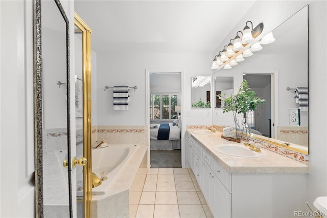 9491 Southern Hills Cir, Lone Tree, CO 80124 - bathroom featuring connected bathroom, double vanity, a bath, and tile patterned flooring