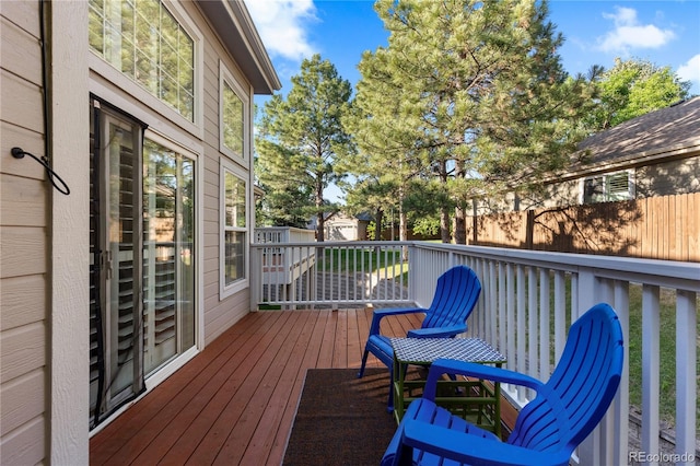 9491 Southern Hills Cir, Lone Tree, CO 80124 - wooden deck featuring a storage unit