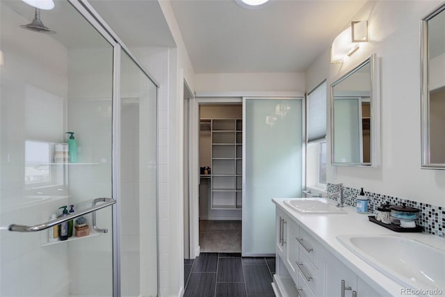 10906 Touchstone Loop, Parker, CO 80134 - full bathroom with a stall shower, double vanity, and a spacious closet
