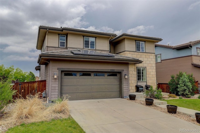 10906 Touchstone Loop, Parker, CO 80134 - view of front of property featuring a garage, driveway, and solar panels