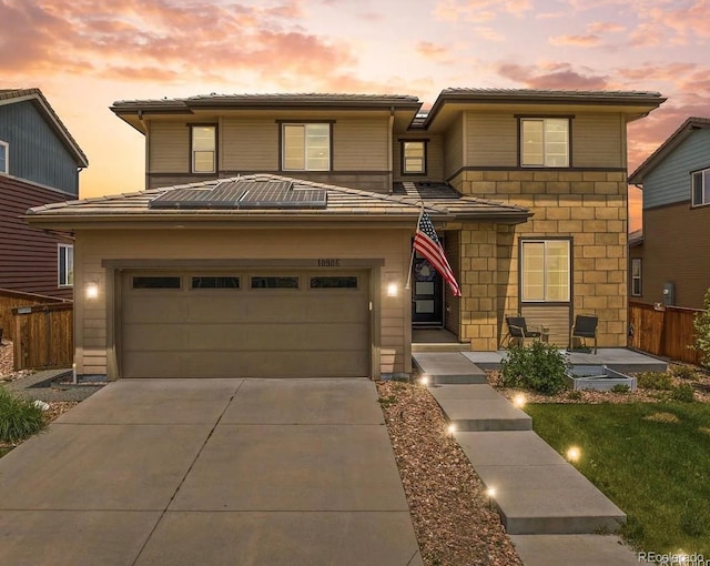 10906 Touchstone Loop, Parker, CO 80134 - view of front of house featuring driveway and stone siding