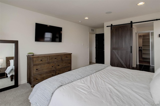 10906 Touchstone Loop, Parker, CO 80134 - carpeted bedroom with recessed lighting and a barn door
