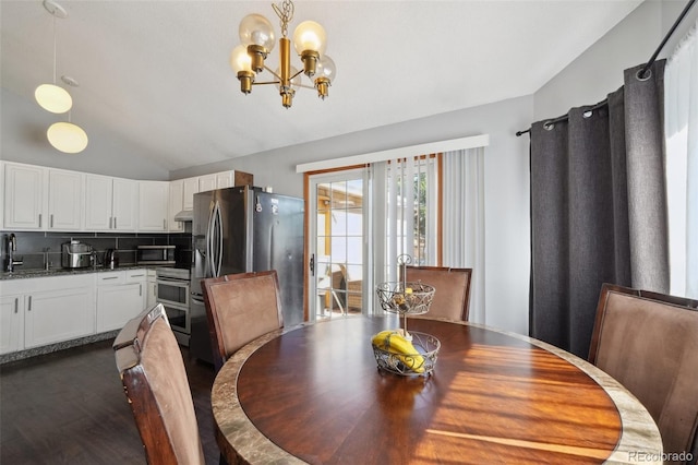 21111 E 43rd Ave, Denver, CO 80249 - dining area with lofted ceiling, a chandelier, and dark wood-type flooring