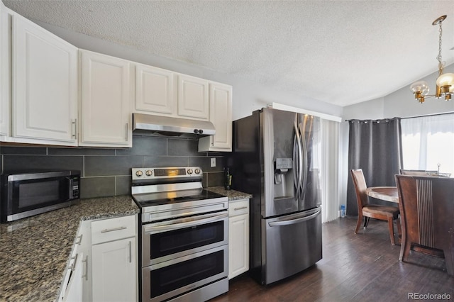 21111 E 43rd Ave, Denver, CO 80249 - kitchen with under cabinet range hood, appliances with stainless steel finishes, a textured ceiling, tasteful backsplash, and a chandelier