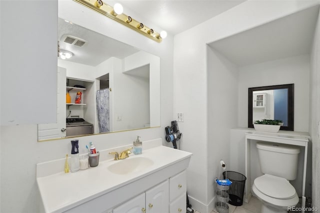 21111 E 43rd Ave, Denver, CO 80249 - full bath featuring toilet, vanity, and tile patterned floors