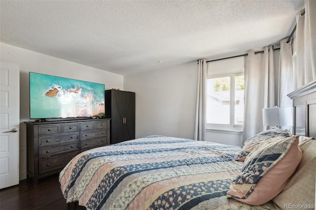 21111 E 43rd Ave, Denver, CO 80249 - bedroom with dark wood-style floors and a textured ceiling