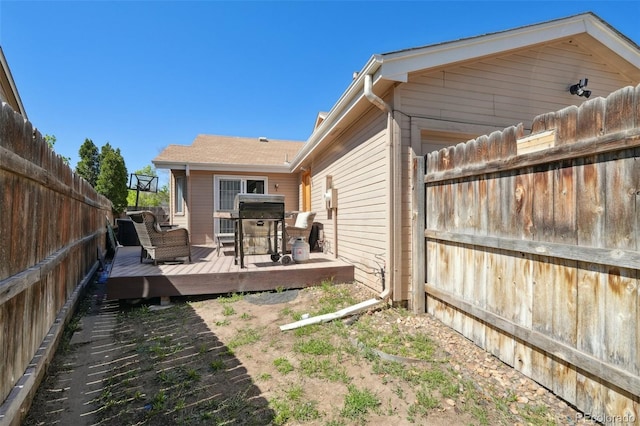 21111 E 43rd Ave, Denver, CO 80249 - back of house featuring a fenced backyard and a wooden deck