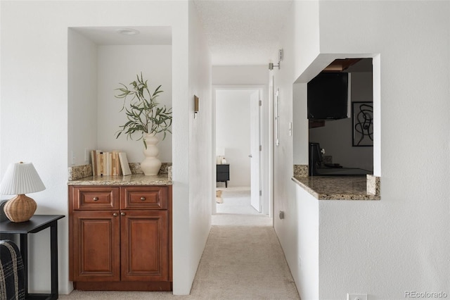 hallway with light carpet