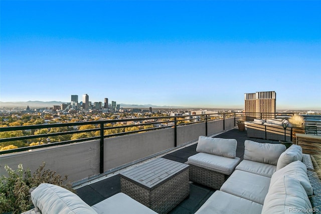 balcony featuring a mountain view and an outdoor hangout area