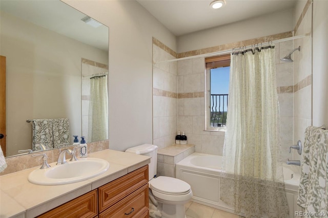 bathroom featuring toilet, visible vents, tile patterned floors, vanity, and shower / bath combo