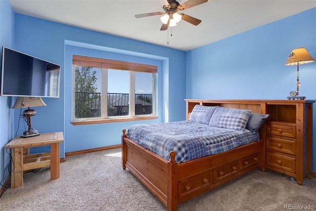 bedroom featuring baseboards, carpet flooring, and a ceiling fan