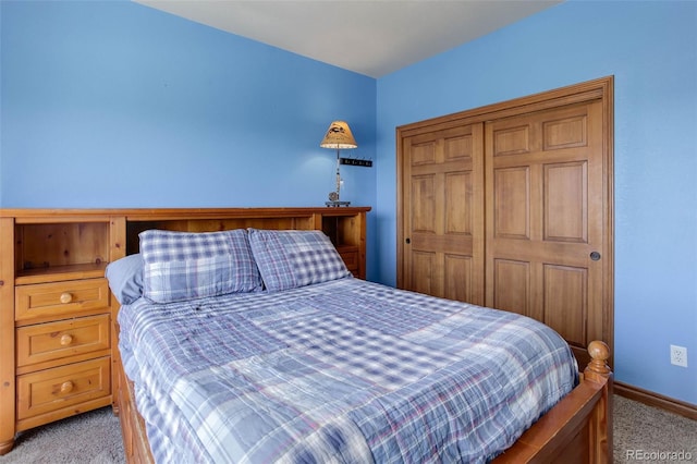 bedroom featuring carpet, a closet, and baseboards