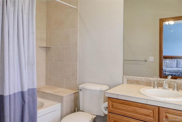 bathroom featuring toilet, vanity, and shower / bath combo with shower curtain