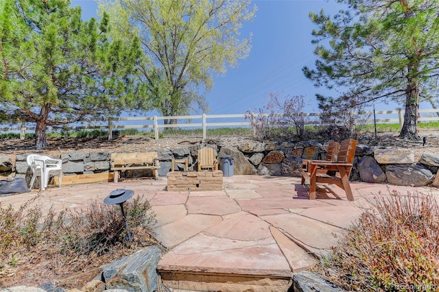 view of patio featuring fence