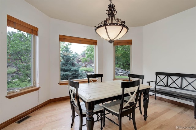 12825 W 81st Ave, Arvada, CO 80005 - dining space featuring light wood-style floors and plenty of natural light