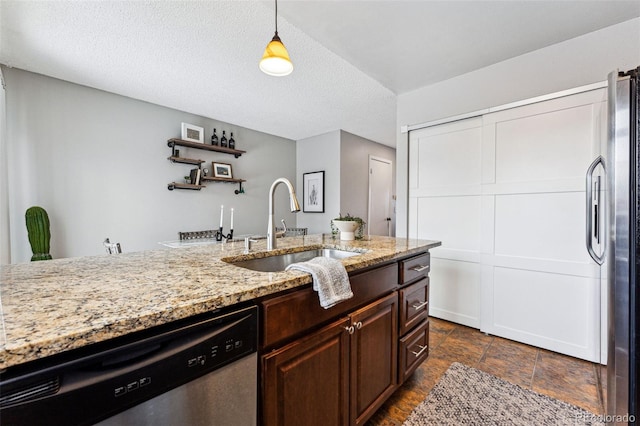 kitchen featuring appliances with stainless steel finishes, decorative light fixtures, light stone countertops, open shelves, and a sink