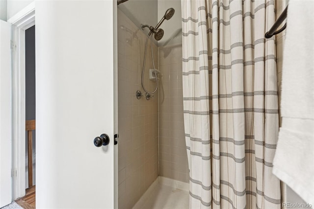 bathroom with a tile shower