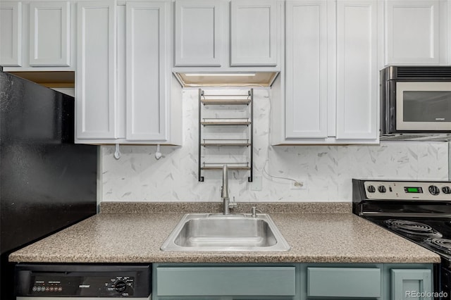6005 W 39th Ave Unit 6005, Wheat Ridge, CO 80033 - kitchen with a sink, freestanding refrigerator, dishwasher, white cabinetry, and stainless steel range with electric cooktop