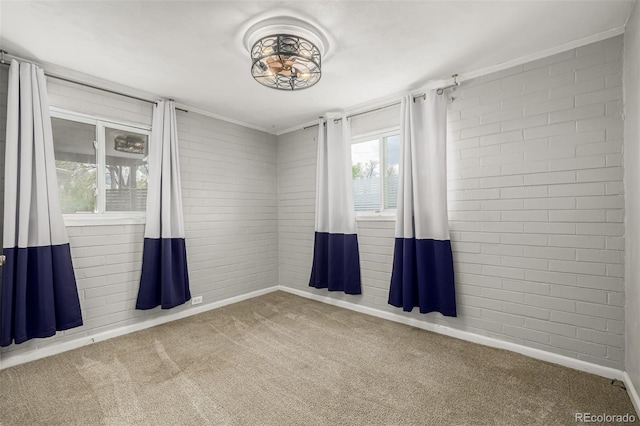 6005 W 39th Ave Unit 6005, Wheat Ridge, CO 80033 - carpeted empty room featuring baseboards and brick wall