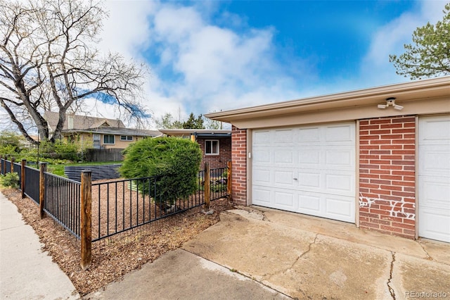 6005 W 39th Ave Unit 6005, Wheat Ridge, CO 80033 - view of front of home with fence and brick siding