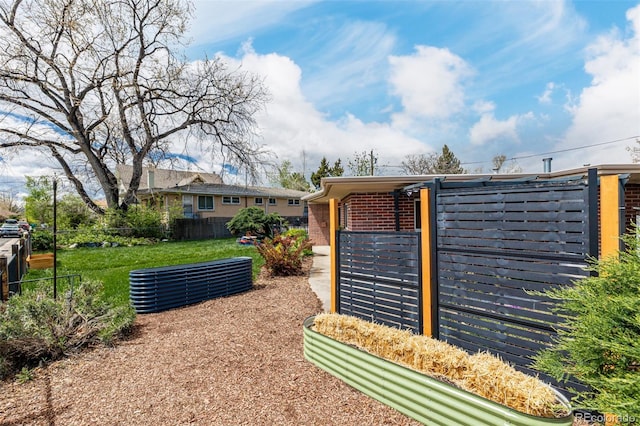 6005 W 39th Ave Unit 6005, Wheat Ridge, CO 80033 - view of gate with a yard and fence