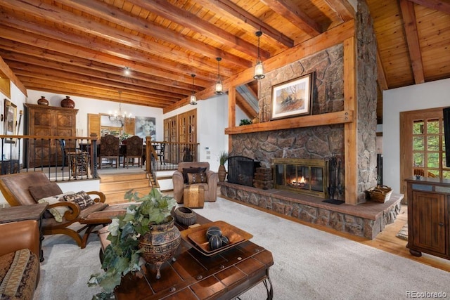 82 Lenawee Ln, Dillon, CO 80435 - living room with wood ceiling with exposed beams, a stone fireplace, and a chandelier