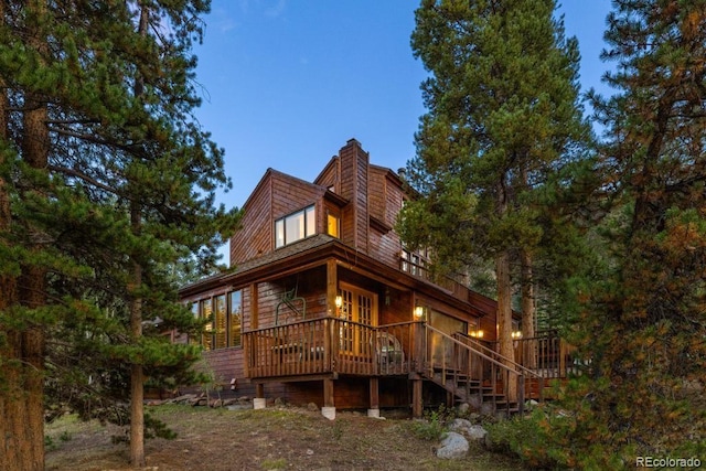 82 Lenawee Ln, Dillon, CO 80435 - back of house with a wooden deck, a chimney, and stairway
