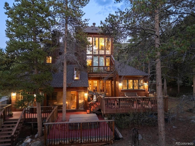 82 Lenawee Ln, Dillon, CO 80435 - rear view of property with roof with shingles and a wooden deck