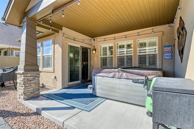 view of patio featuring a hot tub