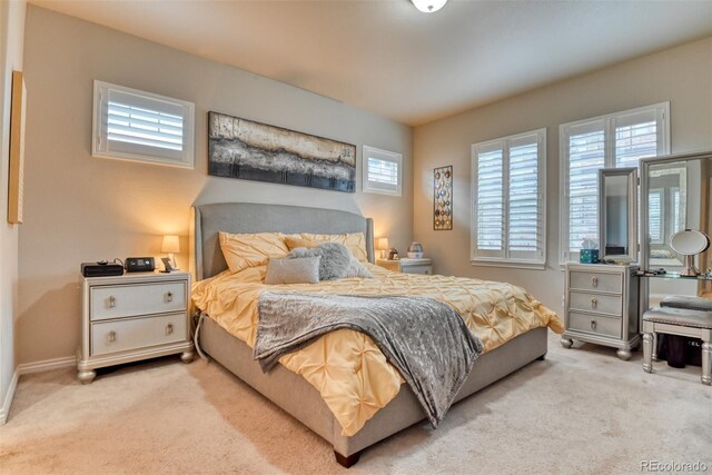 4544 Portillo Pl, Colorado Springs, CO 80924 - carpeted bedroom featuring baseboards and multiple windows