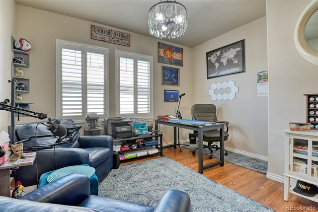 4544 Portillo Pl, Colorado Springs, CO 80924 - office space with wood finished floors, baseboards, and an inviting chandelier
