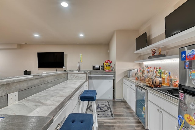 4544 Portillo Pl, Colorado Springs, CO 80924 - kitchen featuring open shelves, wood finished floors, beverage cooler, white cabinets, and recessed lighting