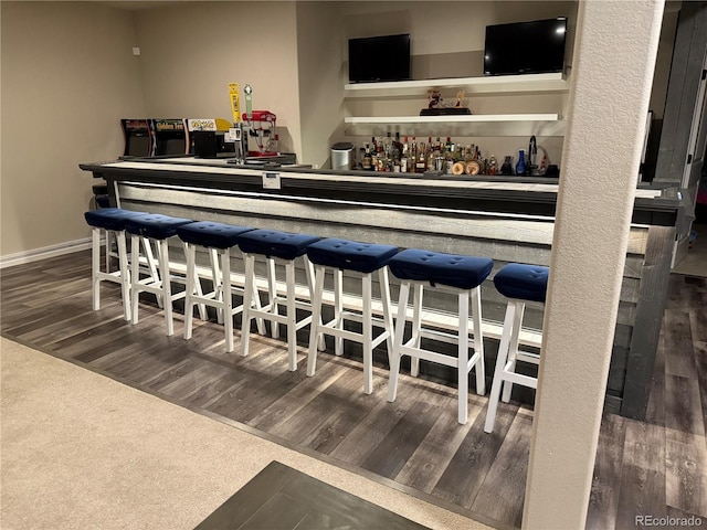 4544 Portillo Pl, Colorado Springs, CO 80924 - bar with wood finished floors and a bar