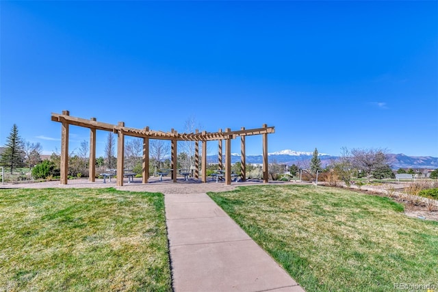 4544 Portillo Pl, Colorado Springs, CO 80924 - view of home's community featuring a pergola, a yard, and a mountain view