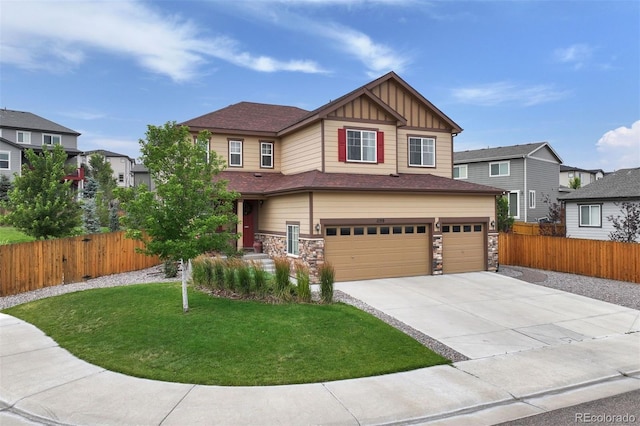 craftsman-style home featuring a garage and a front lawn