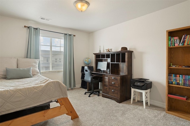 bedroom featuring light carpet