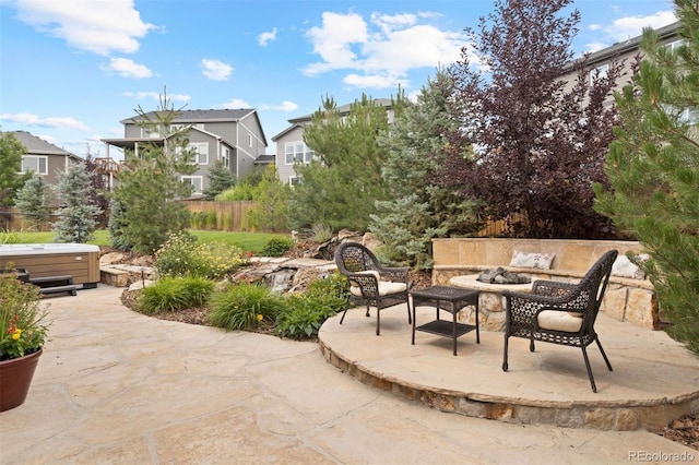 view of patio / terrace with a hot tub