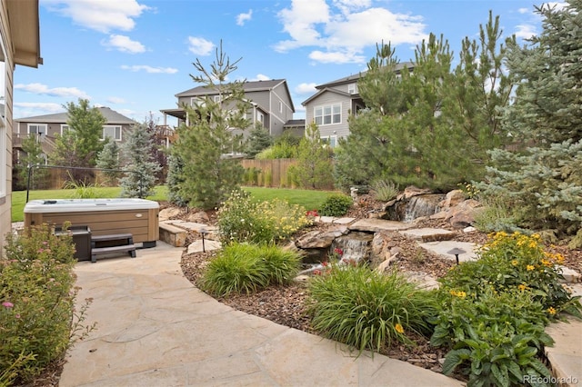 view of yard featuring a patio and a hot tub