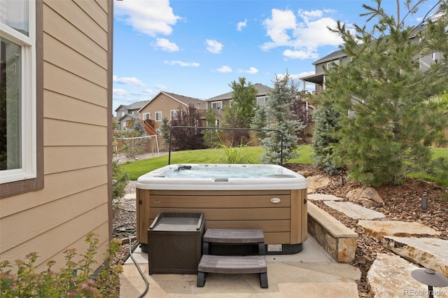 view of patio / terrace with a hot tub