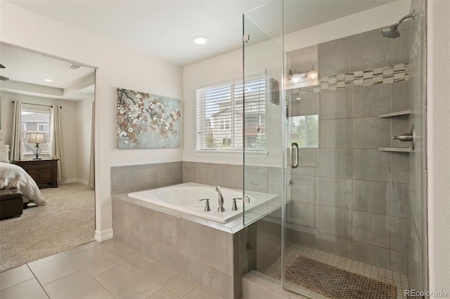 bathroom featuring independent shower and bath and tile patterned flooring