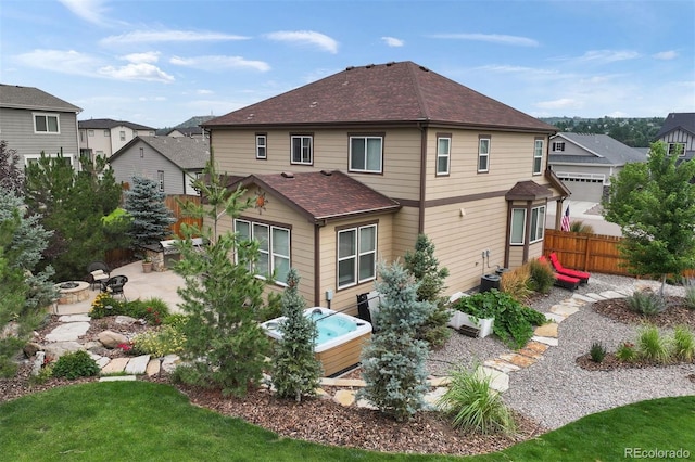 back of property featuring a patio and central AC