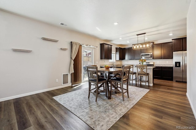 dining area with recessed lighting, visible vents, dark wood finished floors, and baseboards