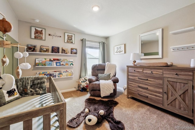 bedroom featuring carpet and baseboards