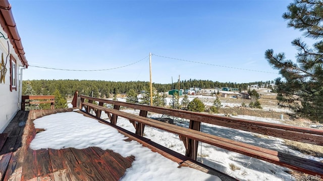 view of snow covered deck