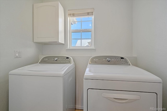 laundry area with cabinets and washer and dryer