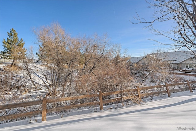 view of yard layered in snow