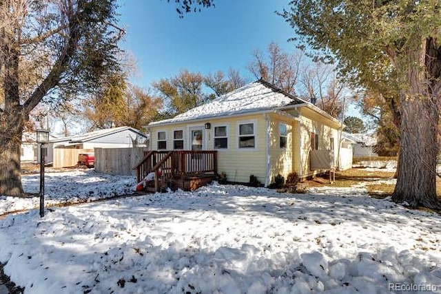 view of snow covered house