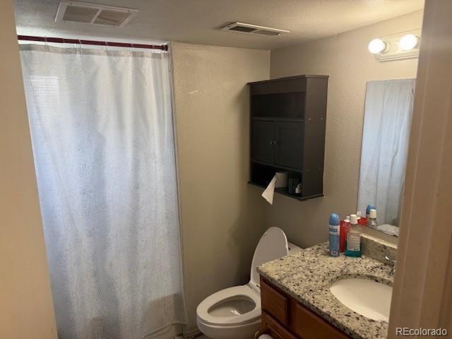 449 Lowell Blvd, Denver, CO 80204 - bathroom featuring vanity and curtained shower