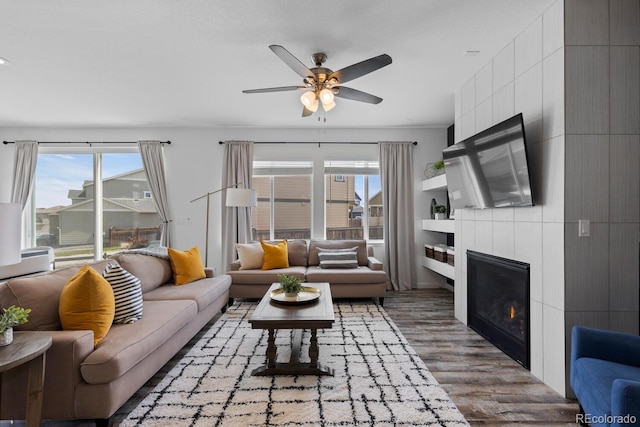 17960 Weymouth Ave, Parker, CO 80134 - living room featuring plenty of natural light, ceiling fan, wood finished floors, and a fireplace